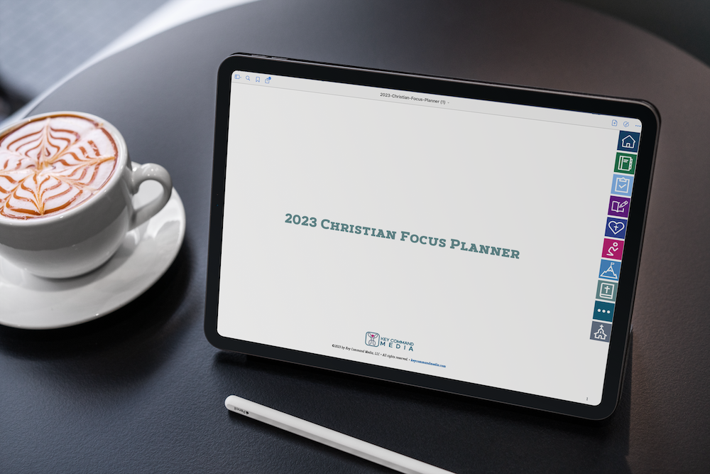 2023-christian-planner-cover the 2023 christian focus digital planner is shown on an ipad with an Apple Pencil and latte at table