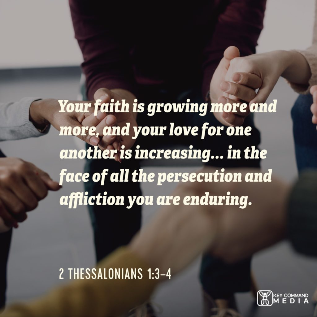 A group of people hold hands in a circle of prayer with 2 Thessalonians 1:3-4, "Your faith is growing more and more, and your love for one another is increasing... in the face of all the persecution and affliction you are enduring."