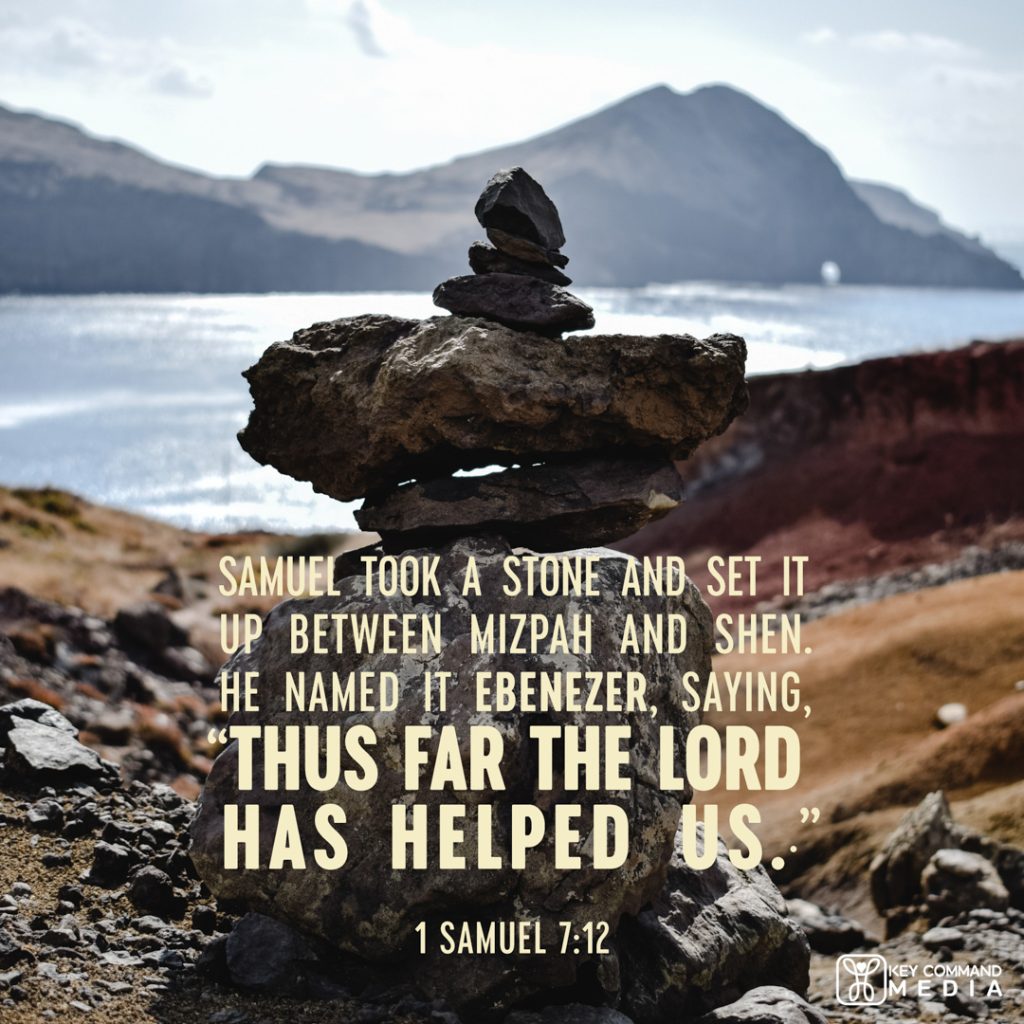 An altar of stones sits near the edge of a lake in Israel with 1 Samuel 7:12, "Samuel took a stone and set it up between Mizpah and Shen. He named it Ebenezer, saying, "Thus far the Lord has helped us."